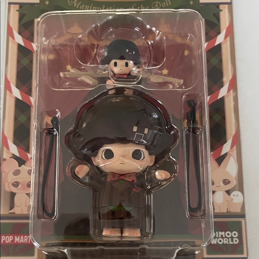 Dimoo Manipulation of the Doll